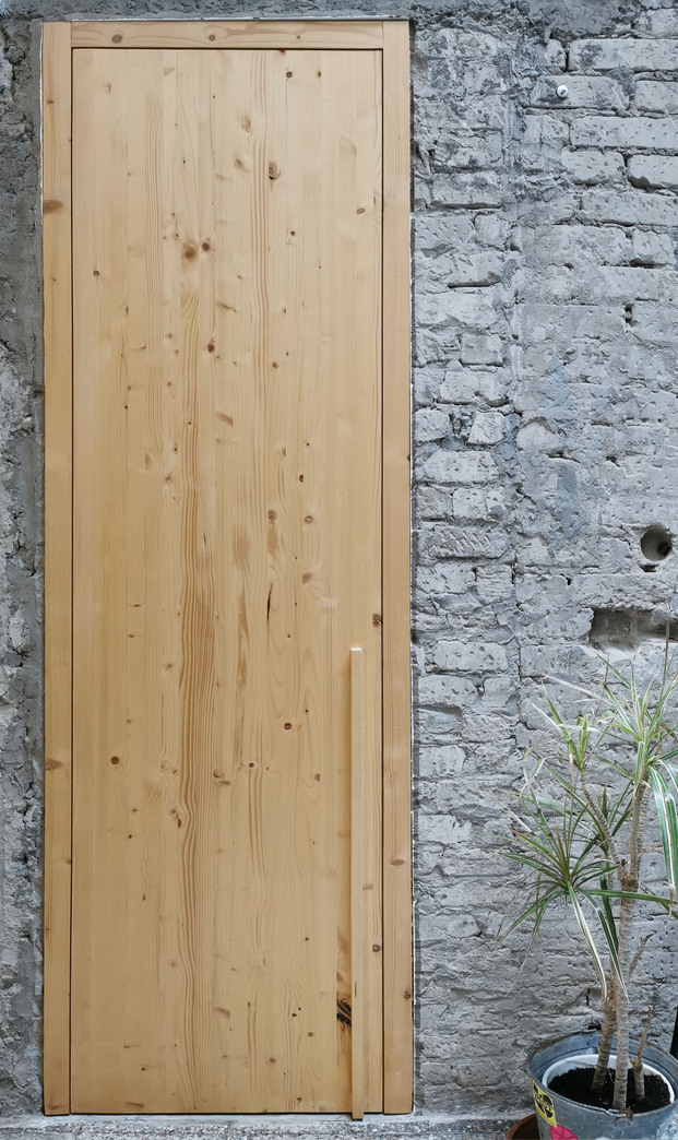 XStudio reforma la vivienda Naked House en las Palmas de Gran Canaria basándose en elementos crudos y austeros como el hormigón, el ladrillo y la madera.